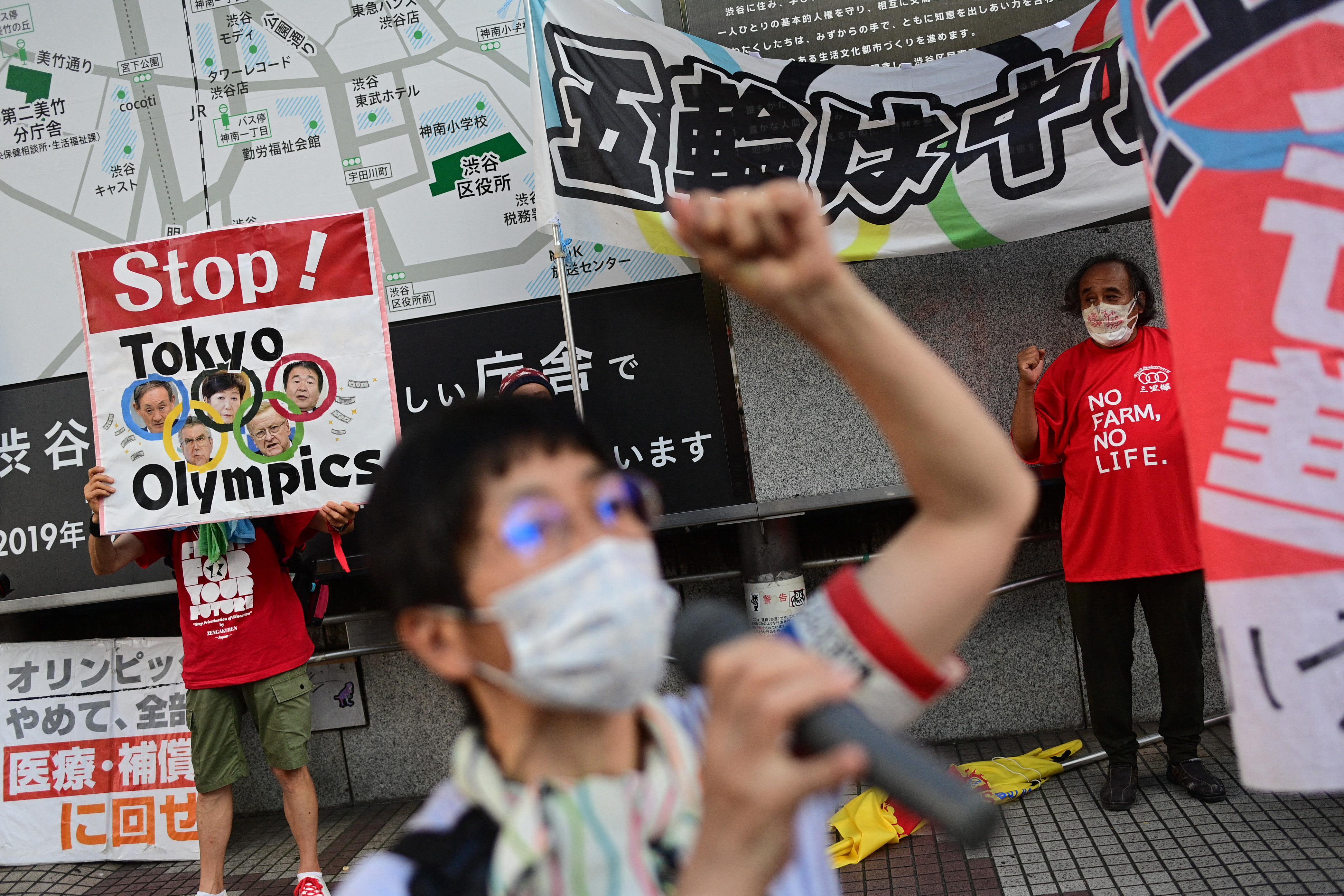 Photos: Nearly empty venues, protests in Tokyo ahead of Olympics opening ceremony