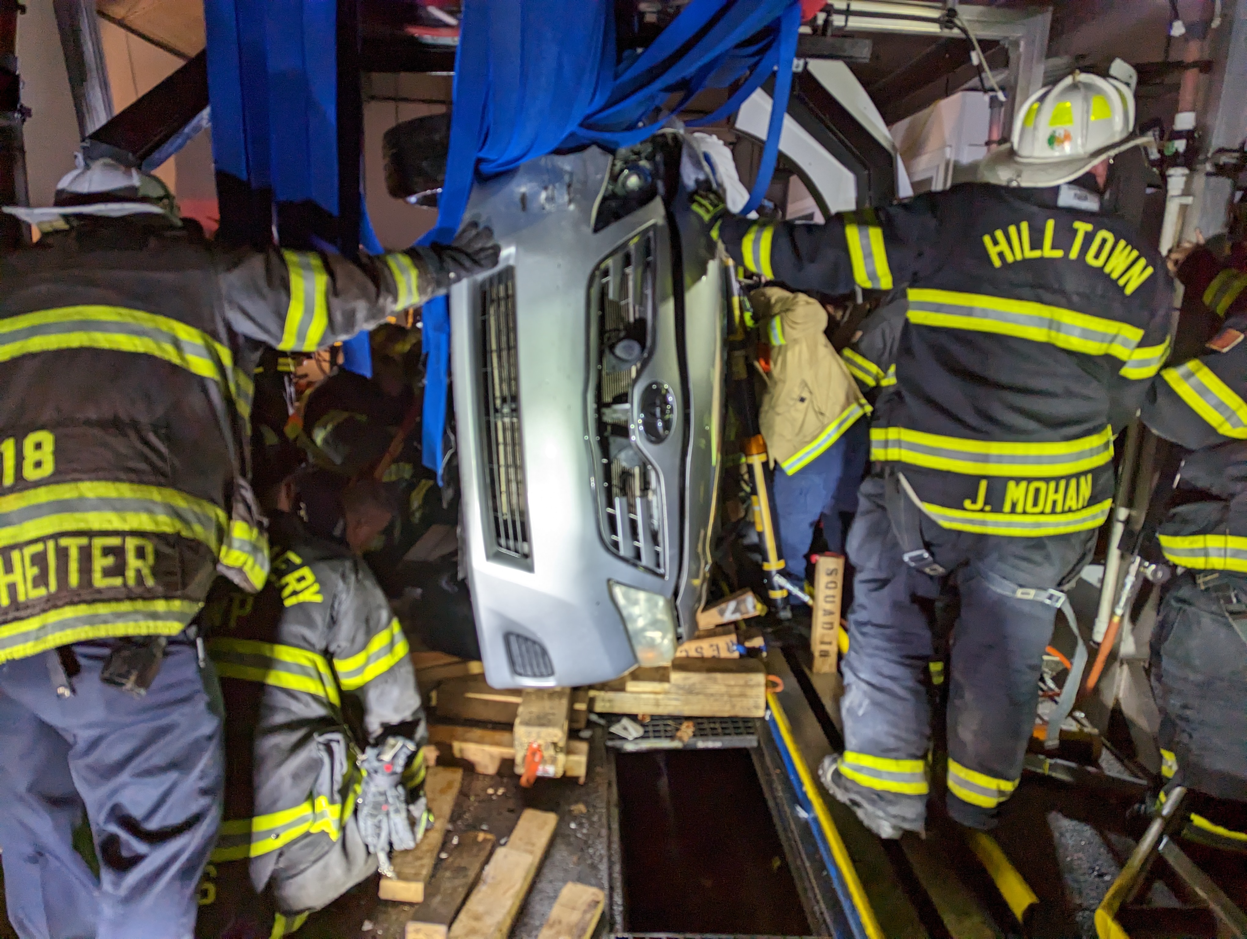 Driver rescued after car flips inside car wash