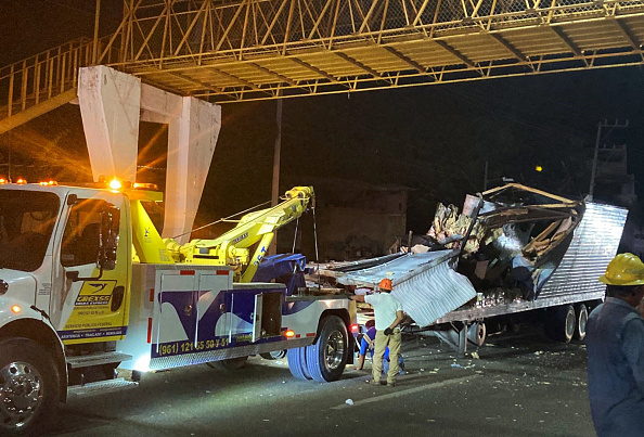 Photos: Mexico truck crash leaves dozens of migrants dead