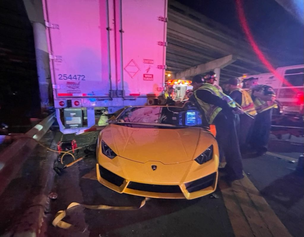 Lamborghini stuck under tractor trailer