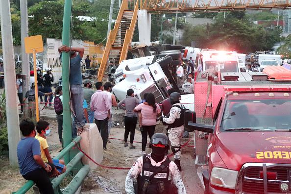 Photos: Mexico truck crash leaves dozens of migrants dead