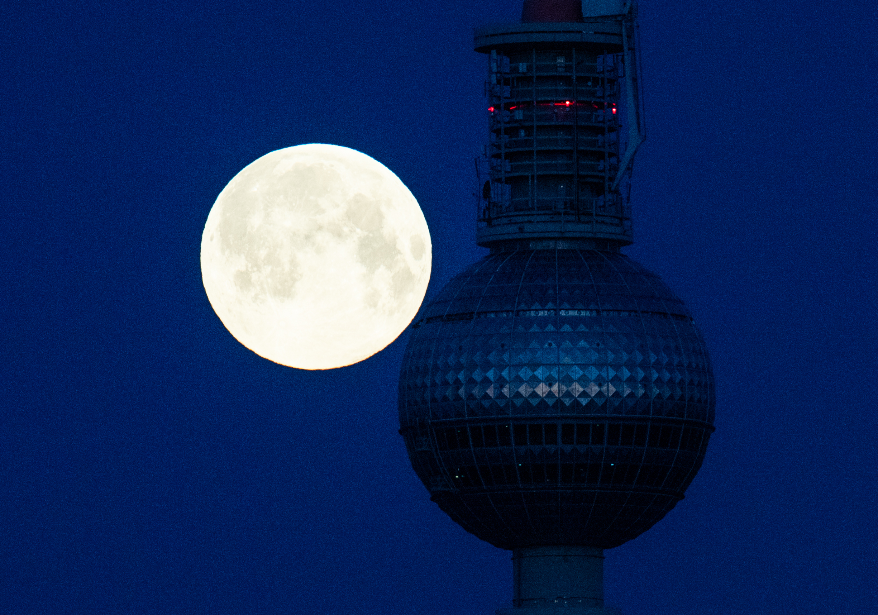 Photos: Super Pink Moon, April's full moon, brightens the night sky