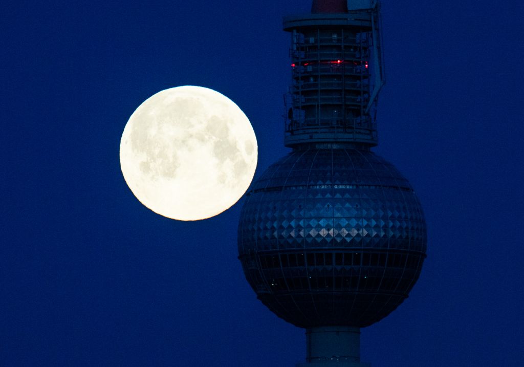 Photos: Super Pink Moon, April's full moon, brightens the night sky