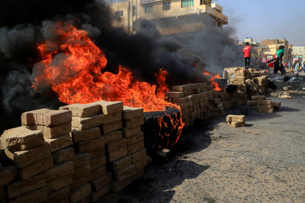 Photos: Sudanese protesters flood streets amid reports of possible military coup