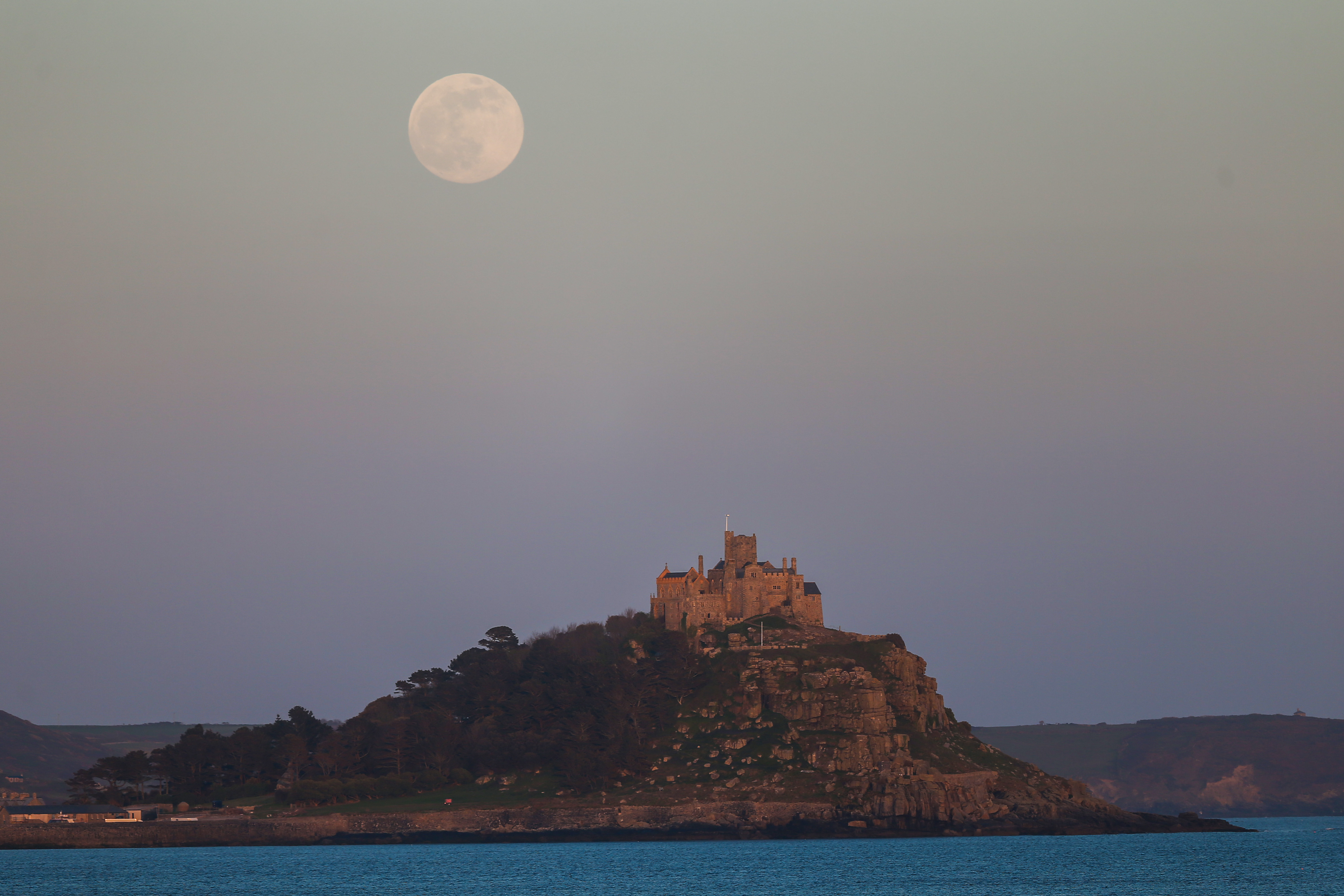 Photos: Super Pink Moon, April's full moon, brightens the night sky