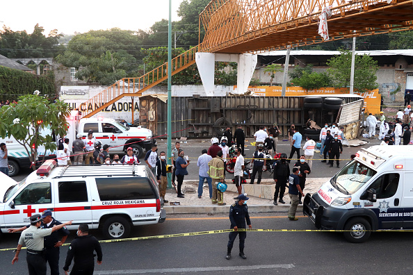 Photos: Mexico truck crash leaves dozens of migrants dead