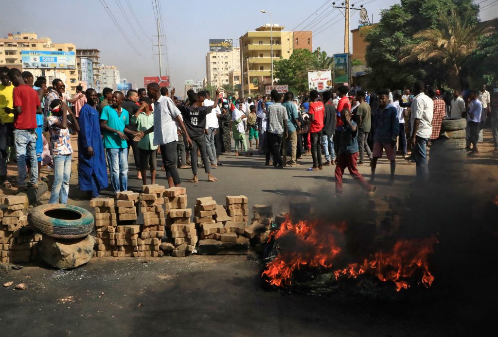 Photos: Sudanese protesters flood streets amid reports of possible military coup