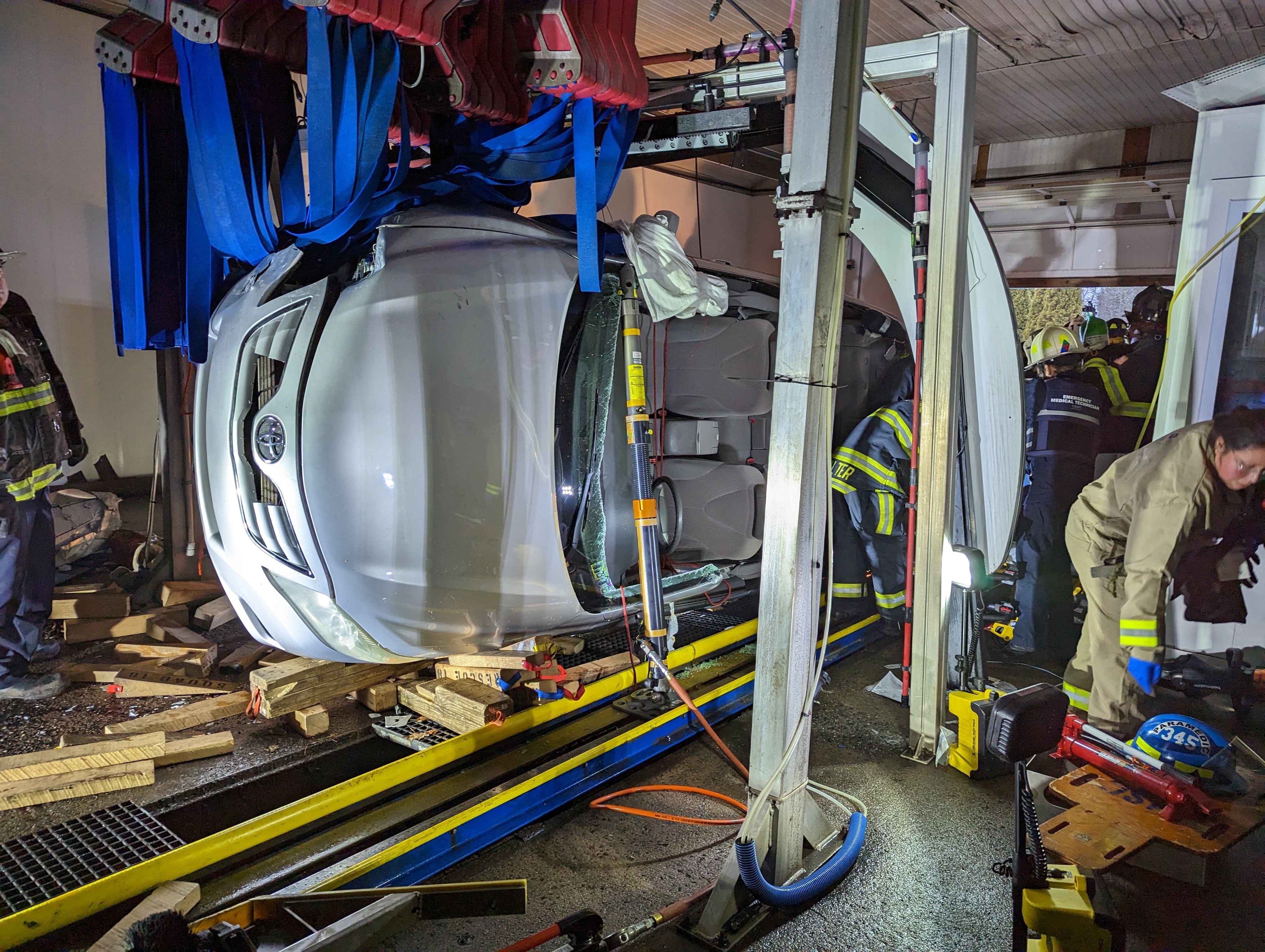 Driver rescued after car flips inside car wash