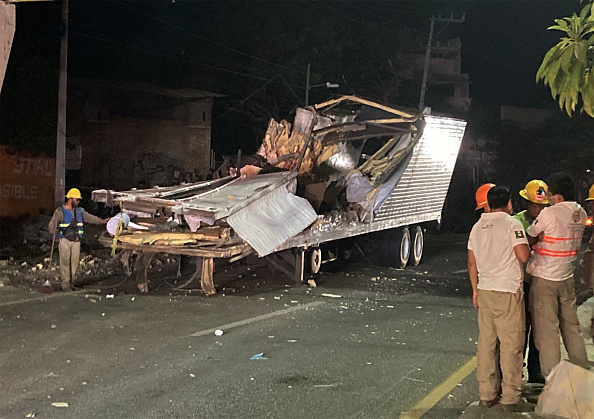 Photos: Mexico truck crash leaves dozens of migrants dead