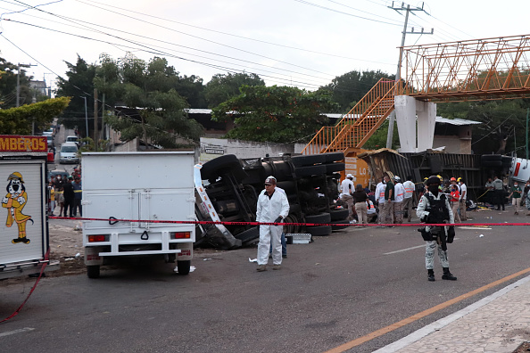 Photos: Mexico truck crash leaves dozens of migrants dead