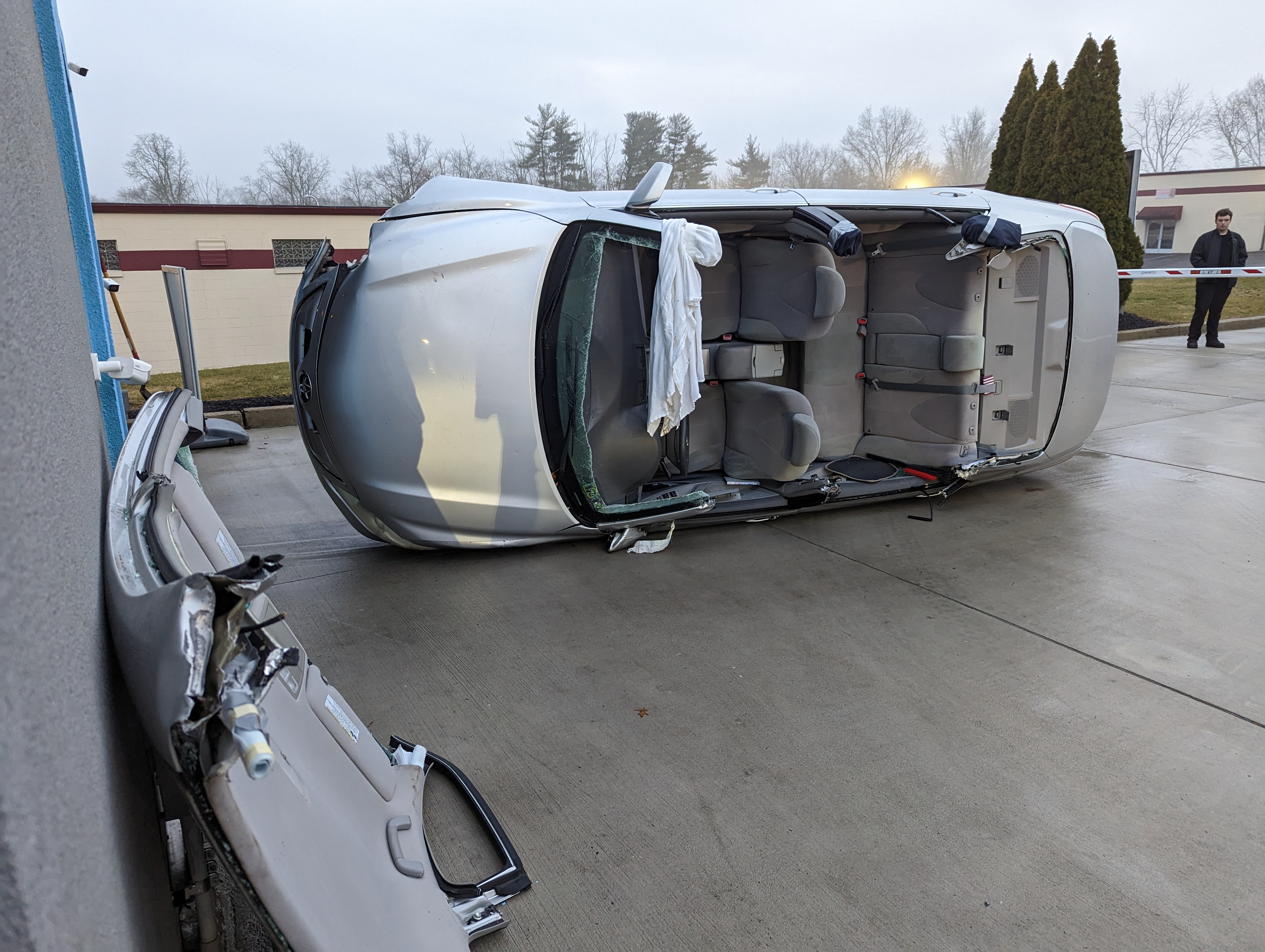 Driver rescued after car flips inside car wash