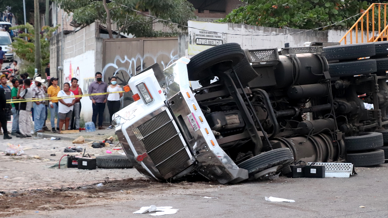 Photos: Mexico truck crash leaves dozens of migrants dead