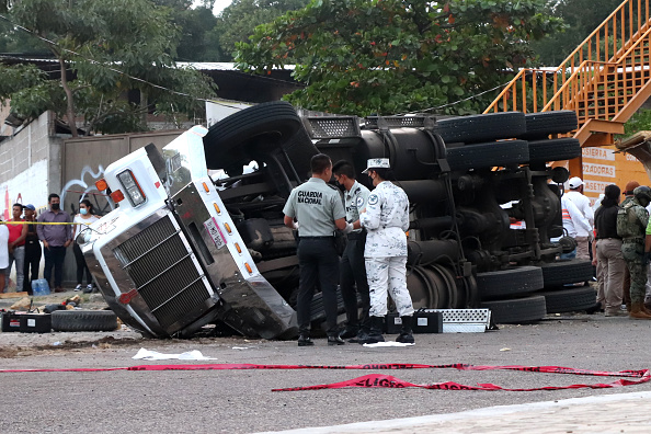Photos: Mexico truck crash leaves dozens of migrants dead
