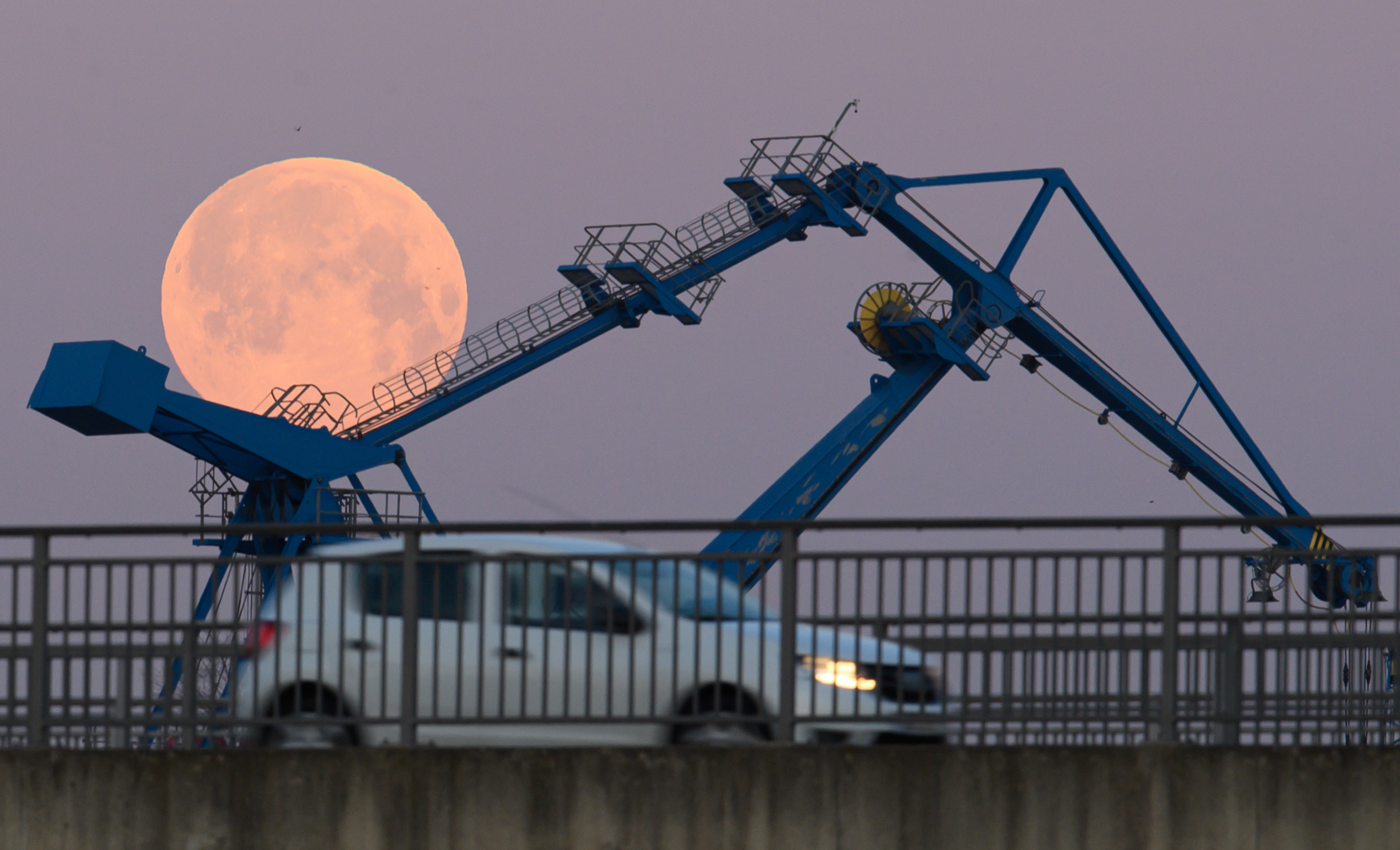 Photos: Super Pink Moon, April's full moon, brightens the night sky