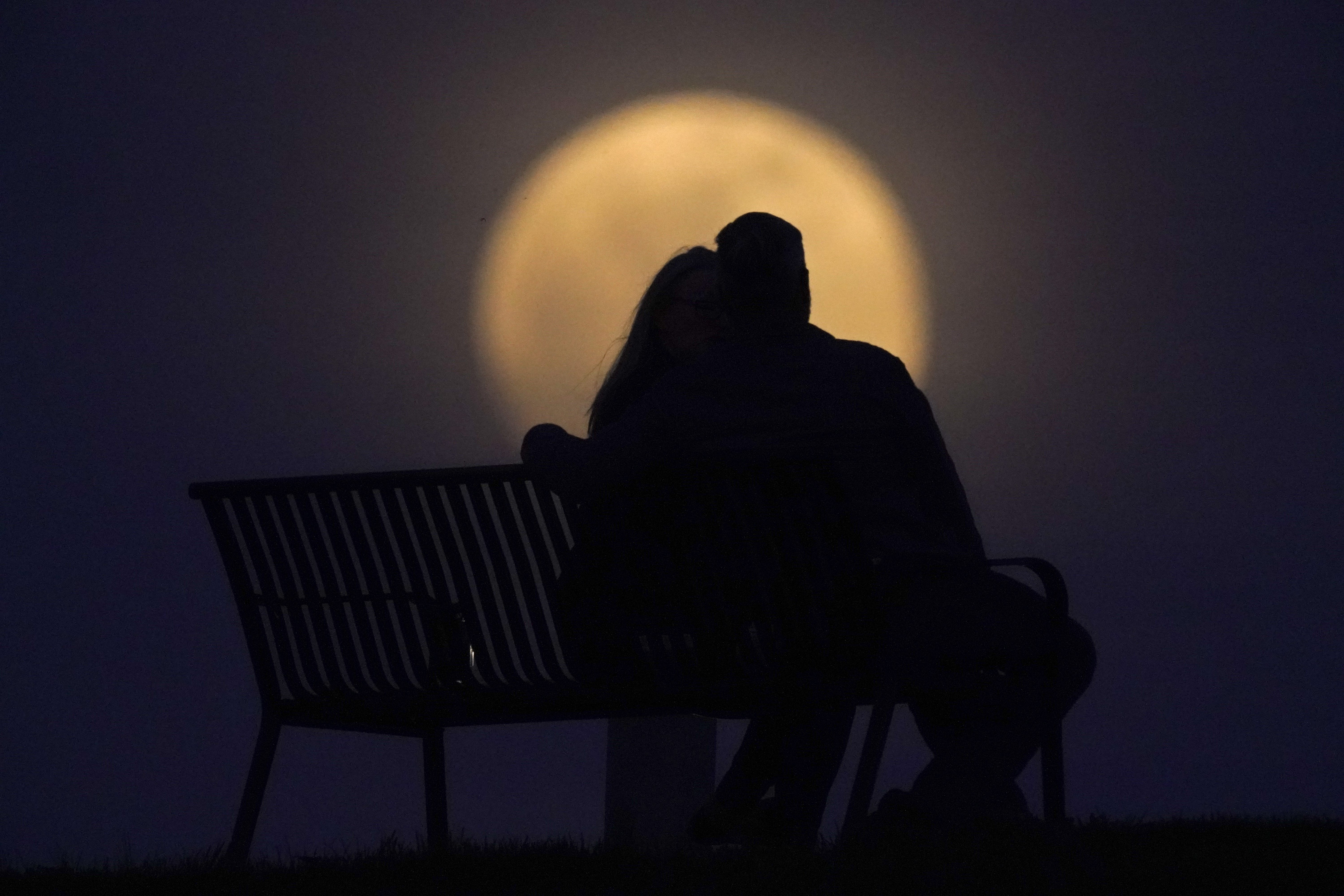 Photos: Super Pink Moon, April's full moon, brightens the night sky
