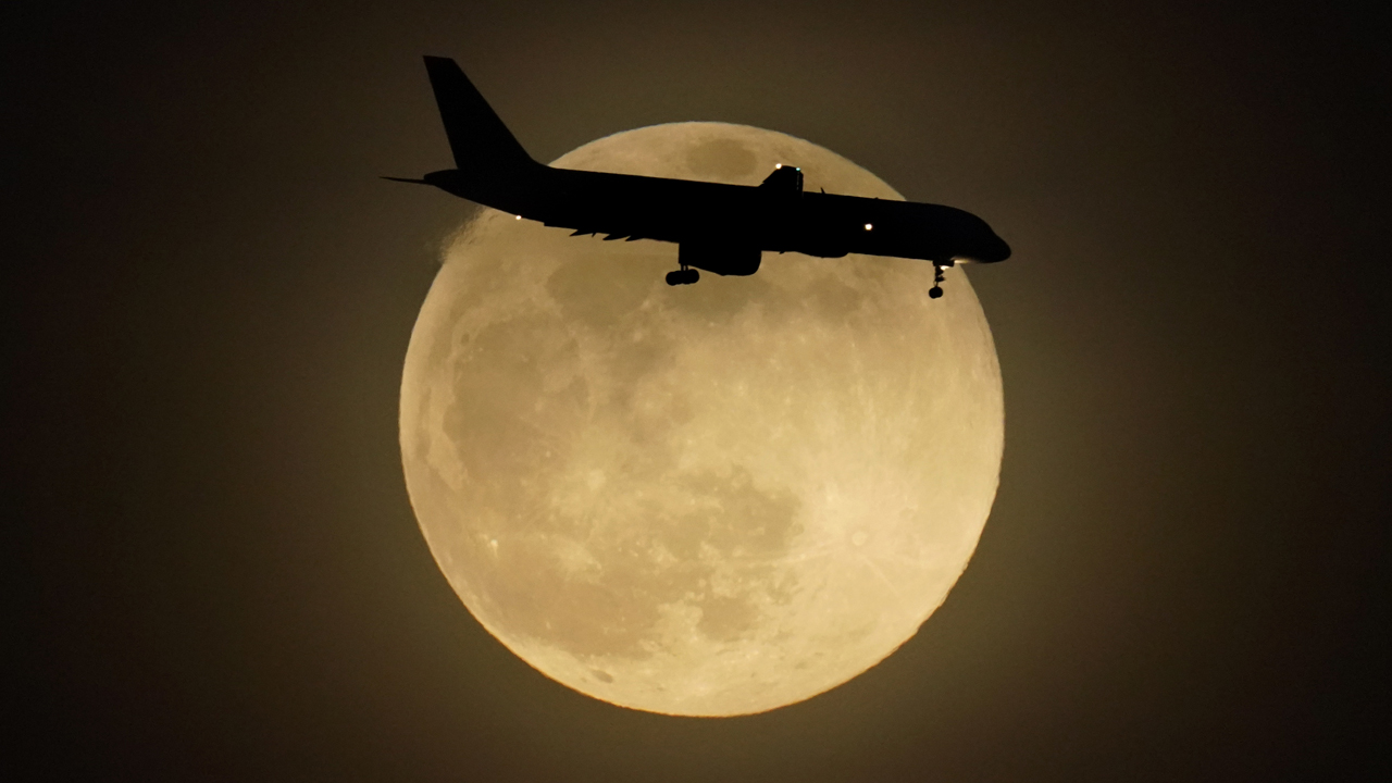 Photos: Super Pink Moon, April's full moon, brightens the night sky