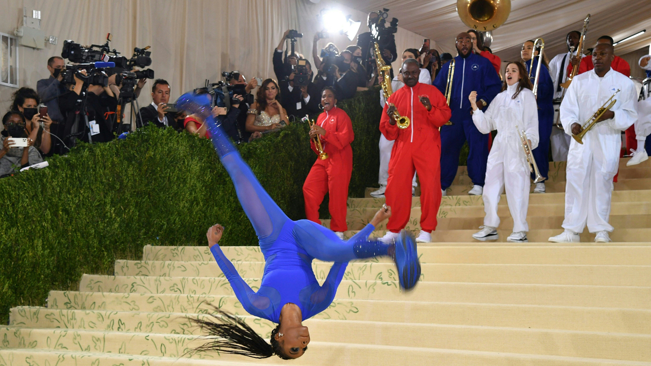 Photos: Gymnast Nia Dennis, marching band steal the show at Met Gala 2021