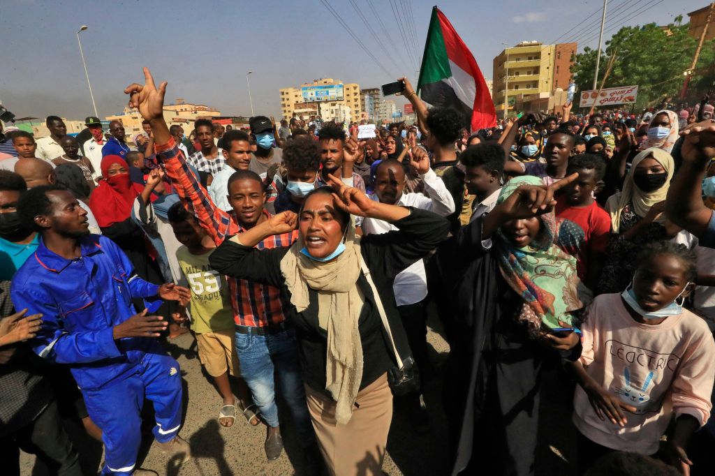 Photos: Sudanese protesters flood streets amid reports of possible military coup