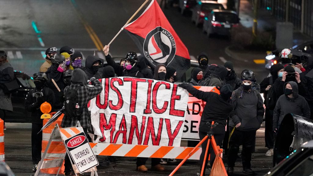 Photos: Protests erupt after police officer drives through crowd in Tacoma, Washington