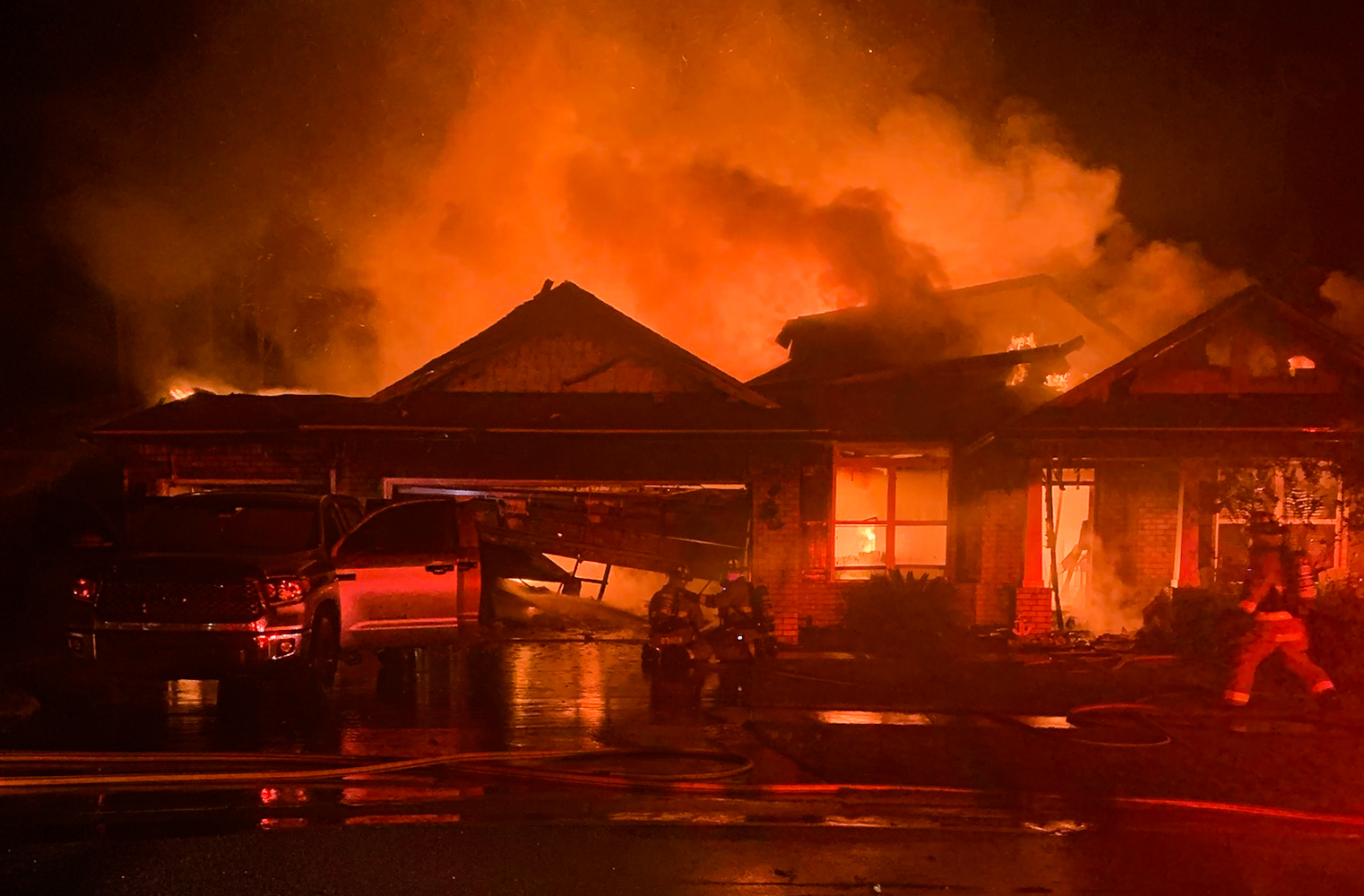 Crews battle house fire