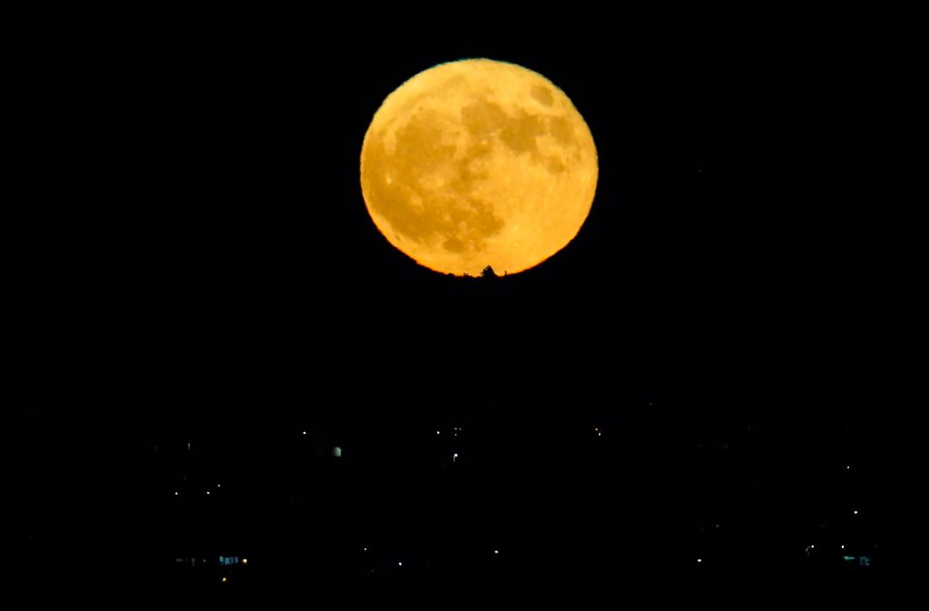 Photos: Halloween Blue Moon brightens the night sky
