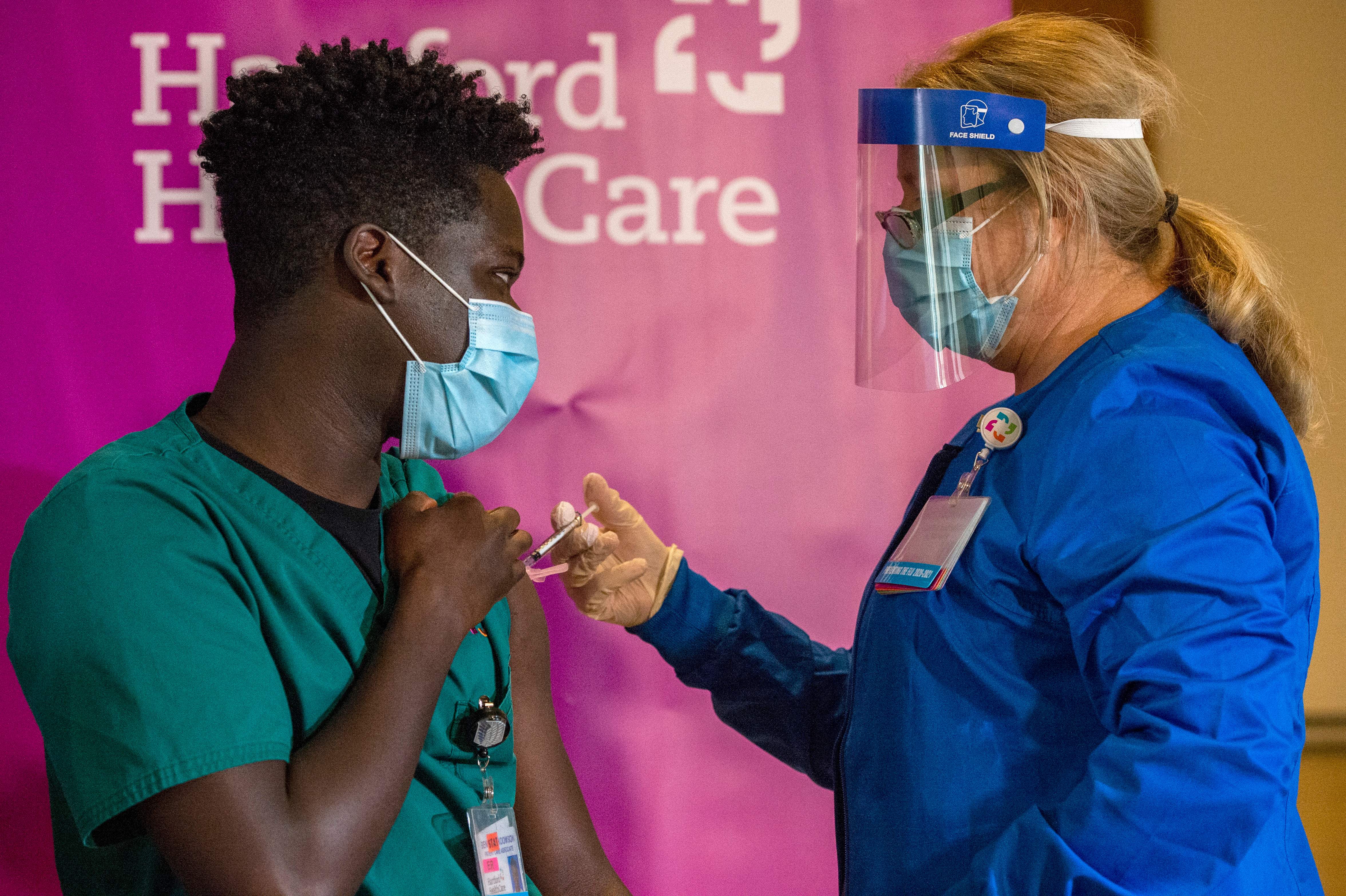 Photos: First Americans vaccinated against COVID-19 receive second dose