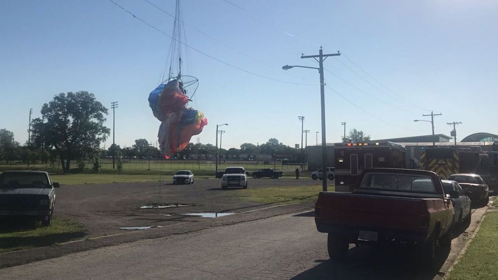 Caught on video: Paraglider gets tangled in power lines