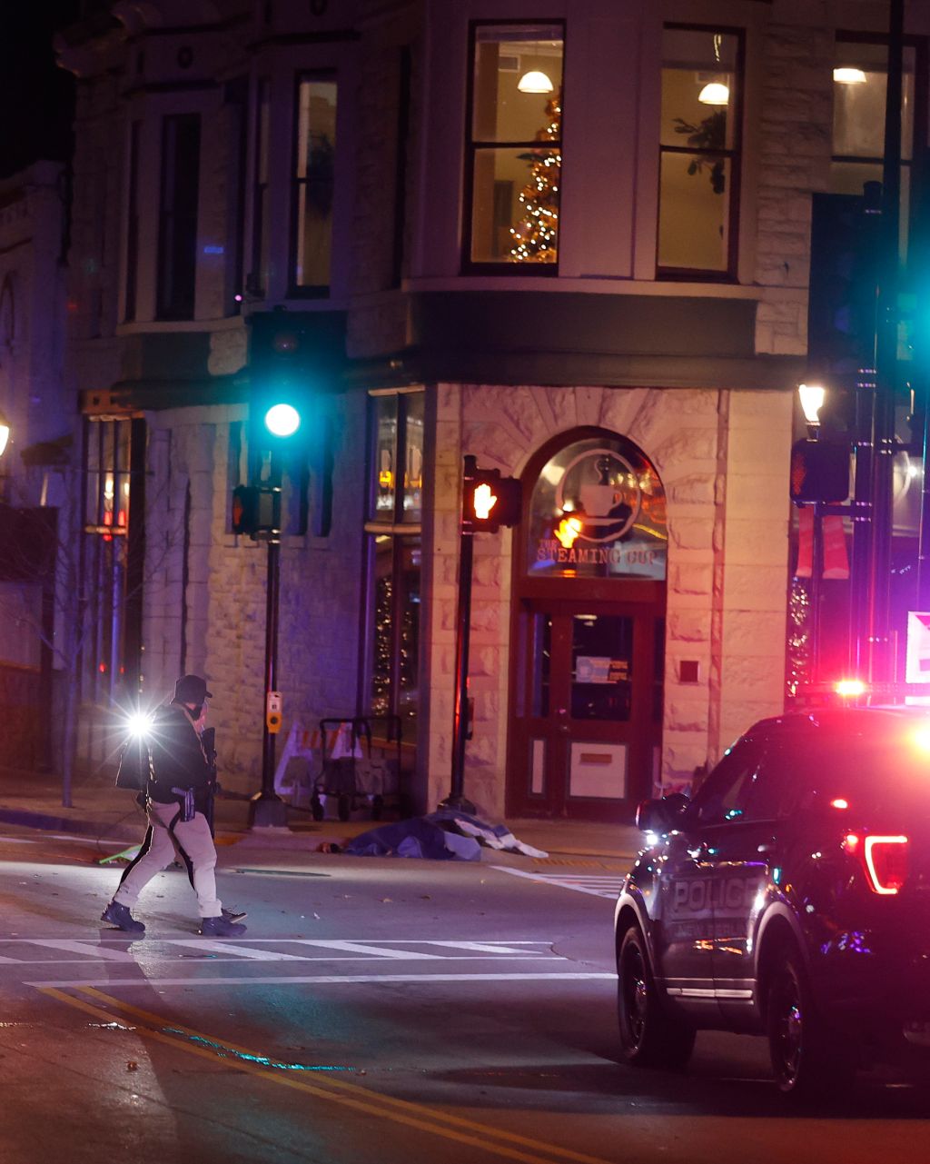 Photos: 5 dead, dozens hurt after SUV plows into Wisconsin holiday parade