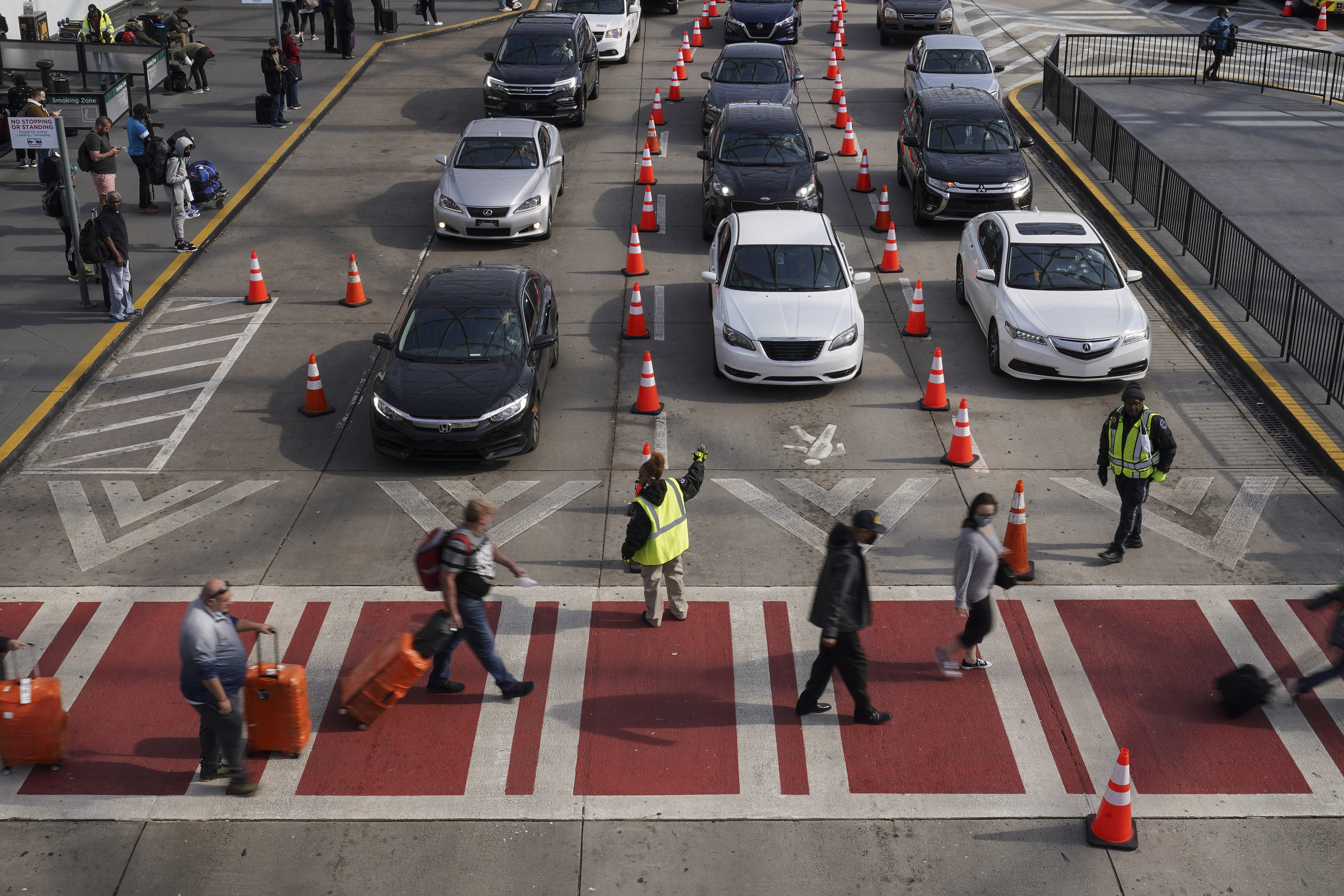 Photos: Thanksgiving travelers flock to airports, freeways ahead of holiday