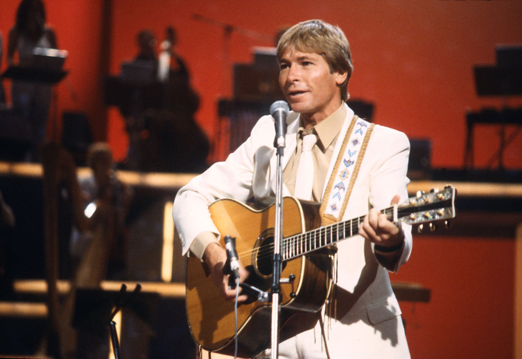 American folk singer-songwriter John Denver performing...