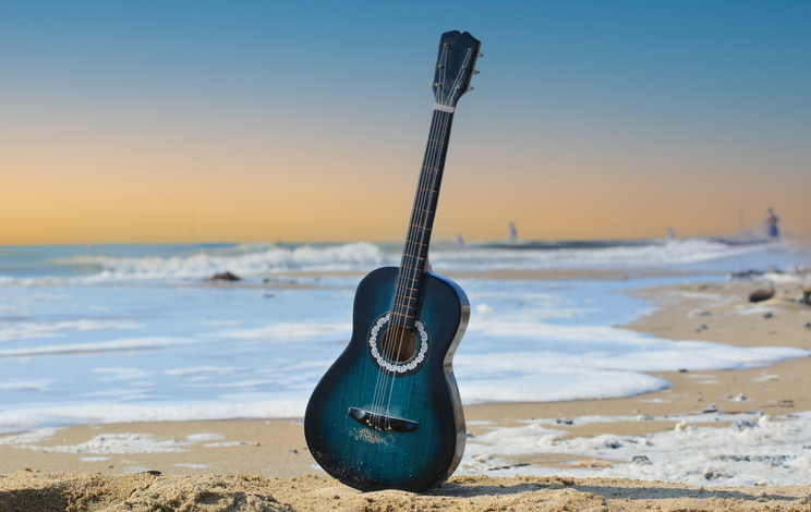 it's dawn on the beach just after the rock concert