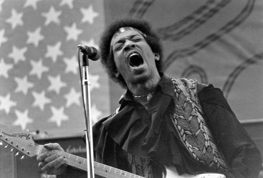 Jimi In Front Of An American Flag