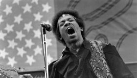 Jimi In Front Of An American Flag