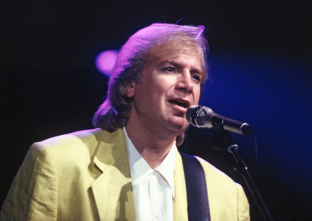 Singer and guitarist Justin Hayward of English music group The Moody Blues performing live...
