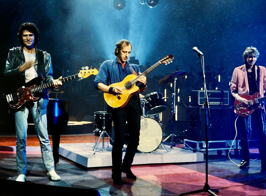 1979: British rock group Dire Straits (Mark Knopfler, David Knopfler, John Illsley and Pick Withers) seen performing live on stage