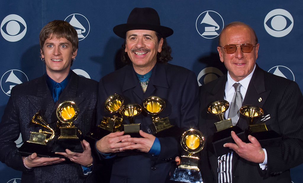 Winners Carlos Santana with Rob Thomas and Clive Davis at Grammy Awards Show 2000