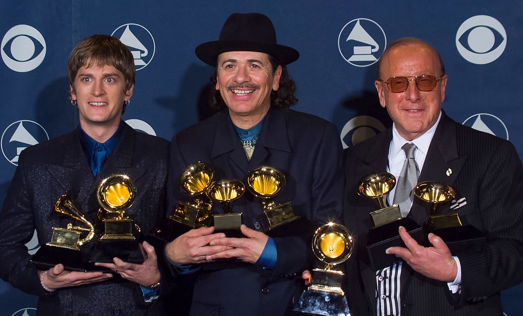 Winners Carlos Santana with Rob Thomas and Clive Davis at Grammy Awards Show 2000
